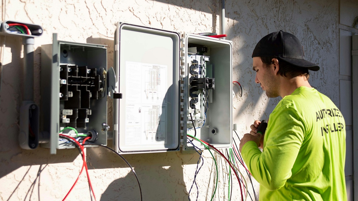 man fixing an electrical panel