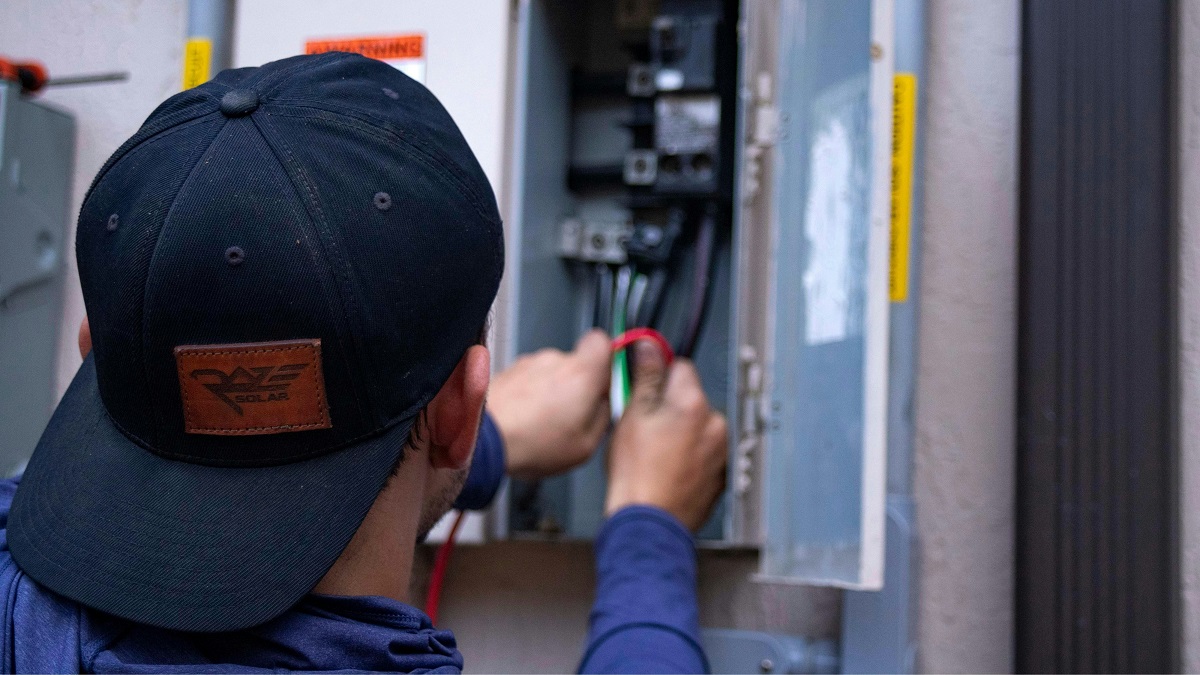 man upgrading a home's electrical panel